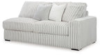 Light gray upholstered sofa with ribbed fabric and three back cushions