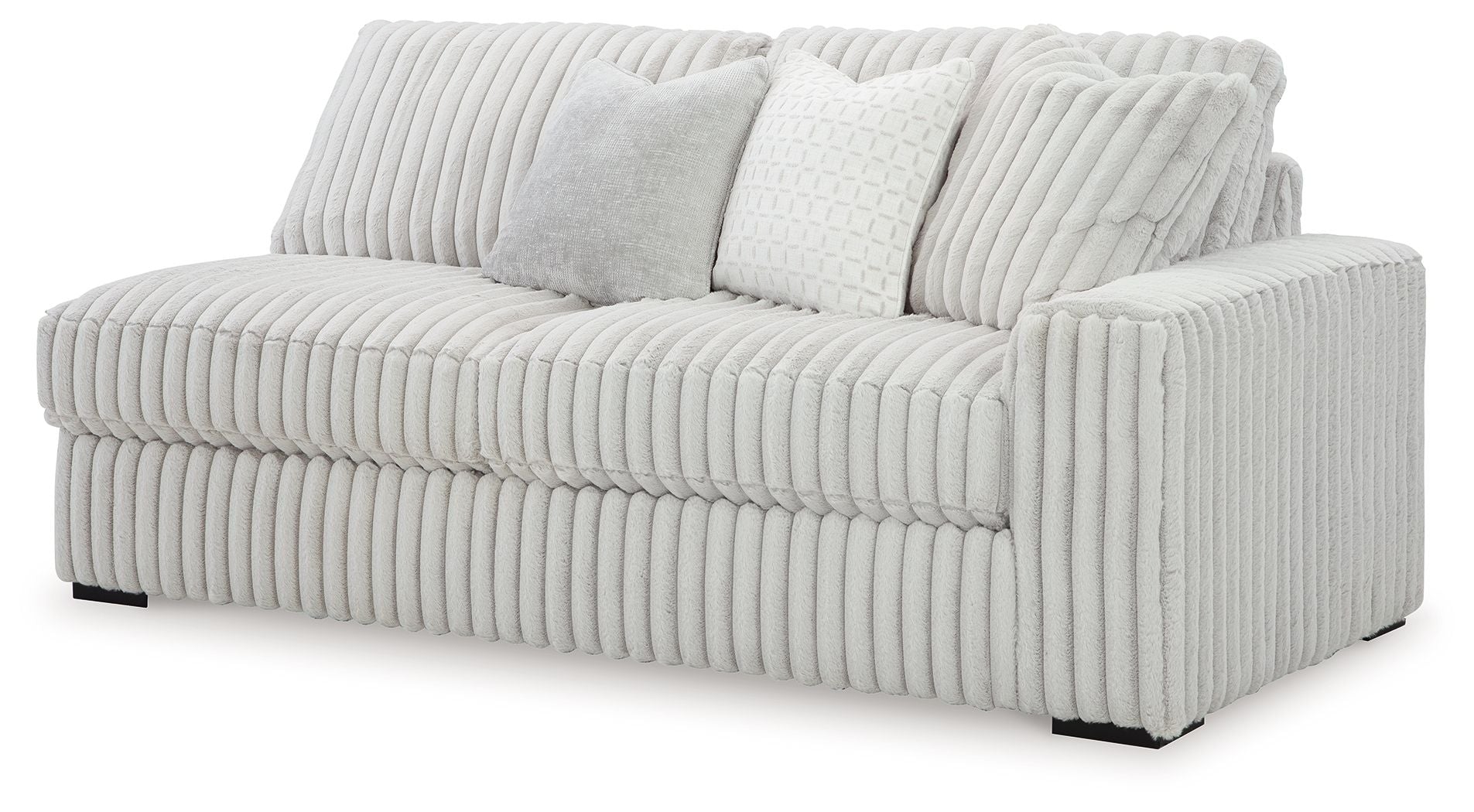 Light gray upholstered sofa with ribbed fabric and three back cushions