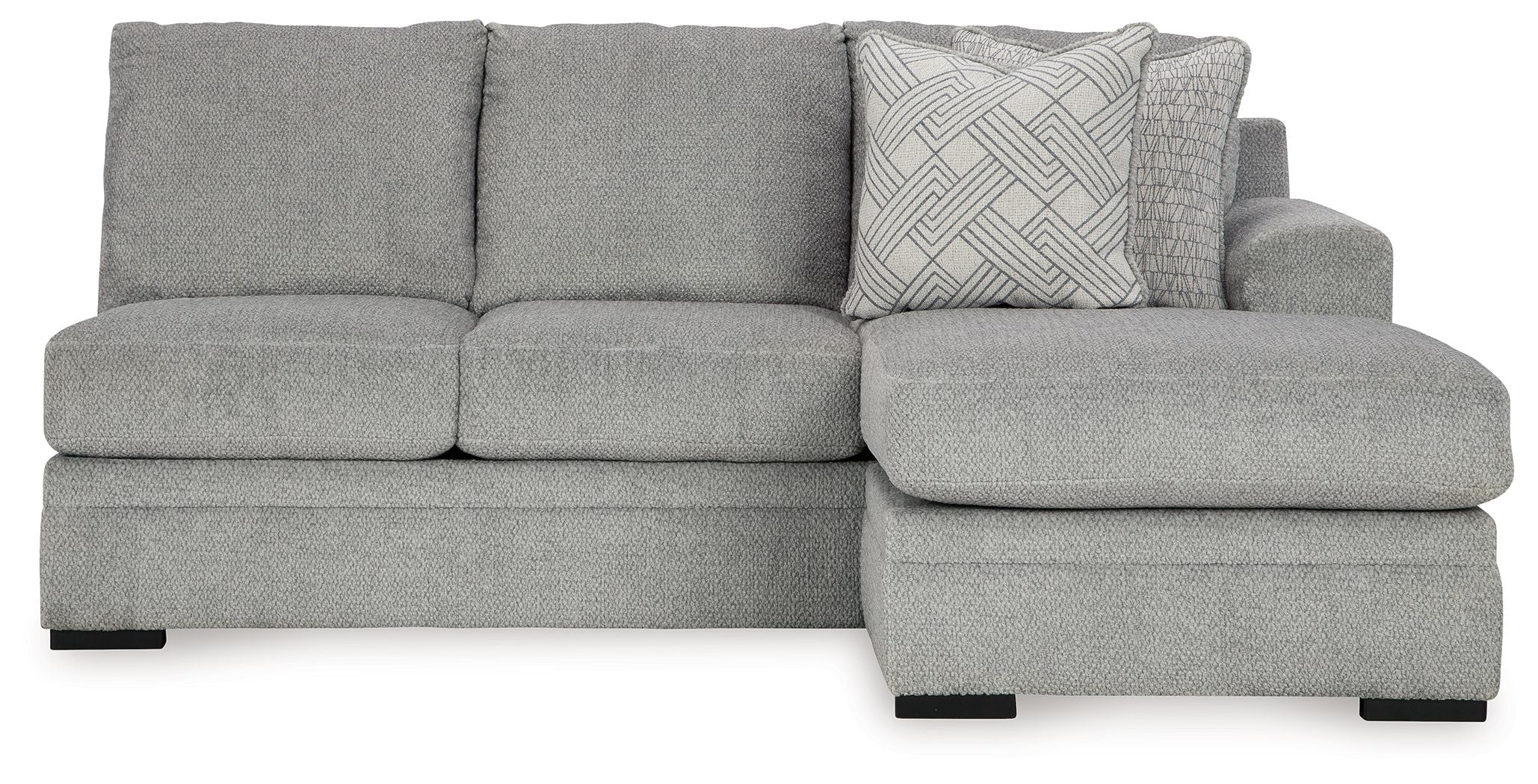 Grey upholstered sofa chaise with textured throw pillow on right end