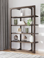 Dark brown wooden bookcase with open shelves and rounded-arch openings, styled with decor
