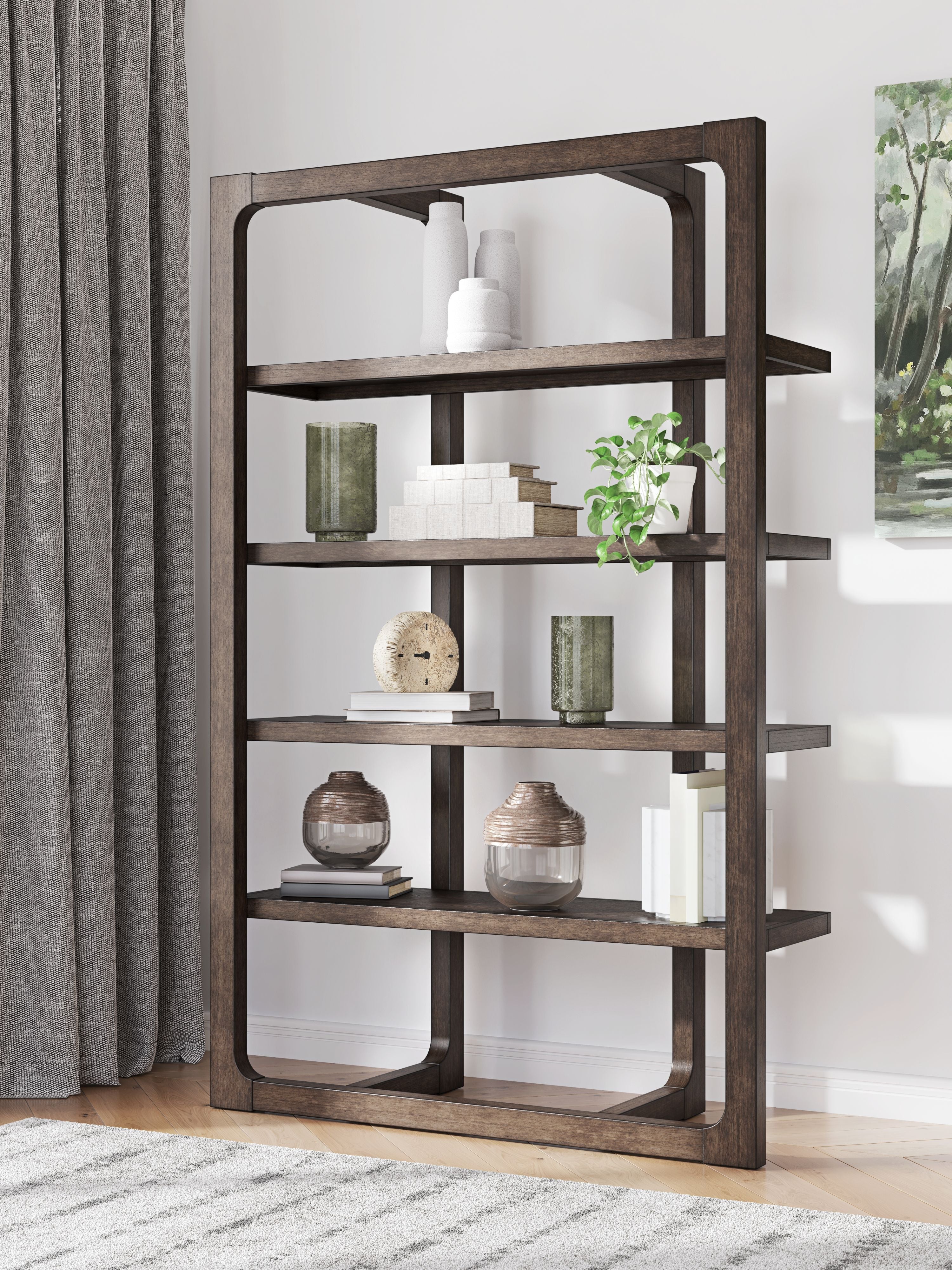 Dark brown wooden bookcase with open shelves and rounded-arch openings, styled with decor