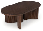 Oval dark brown cocktail table with curved tabletop, ribbed sides, and center leg
