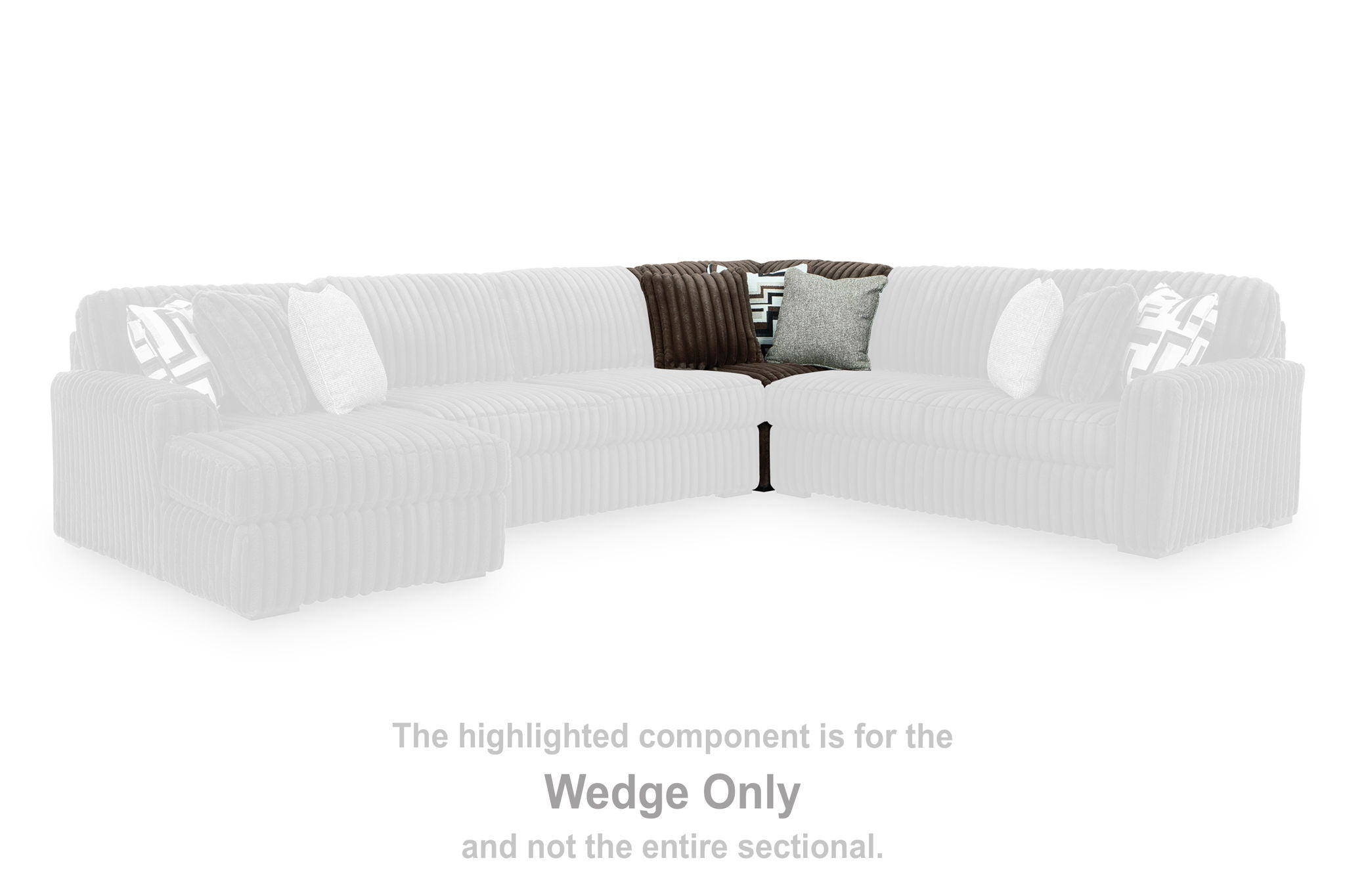 White sectional wedge with rounded arms and two accent pillows
