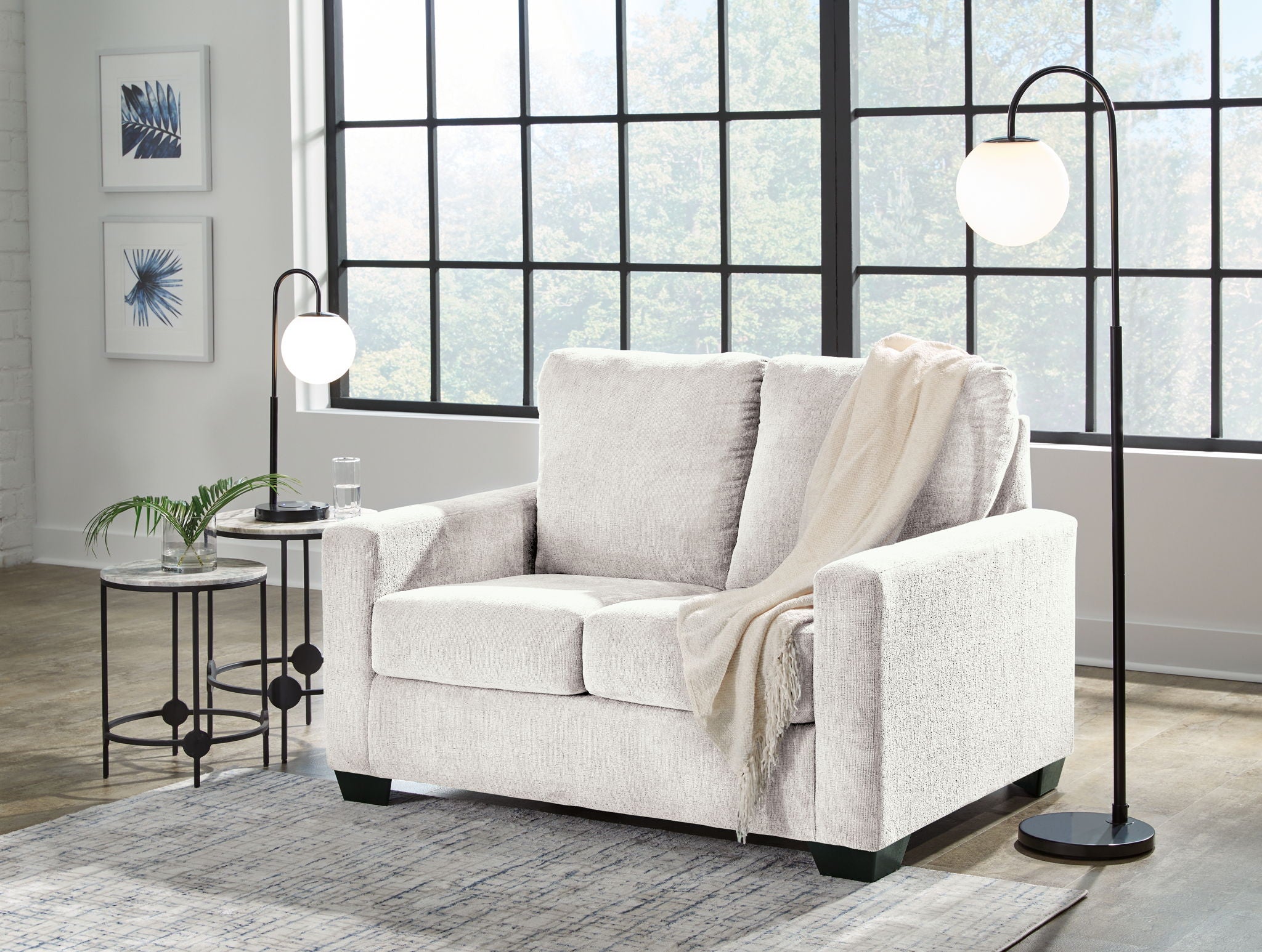 Beige sofa set with matching armchair, styled with neutral throws