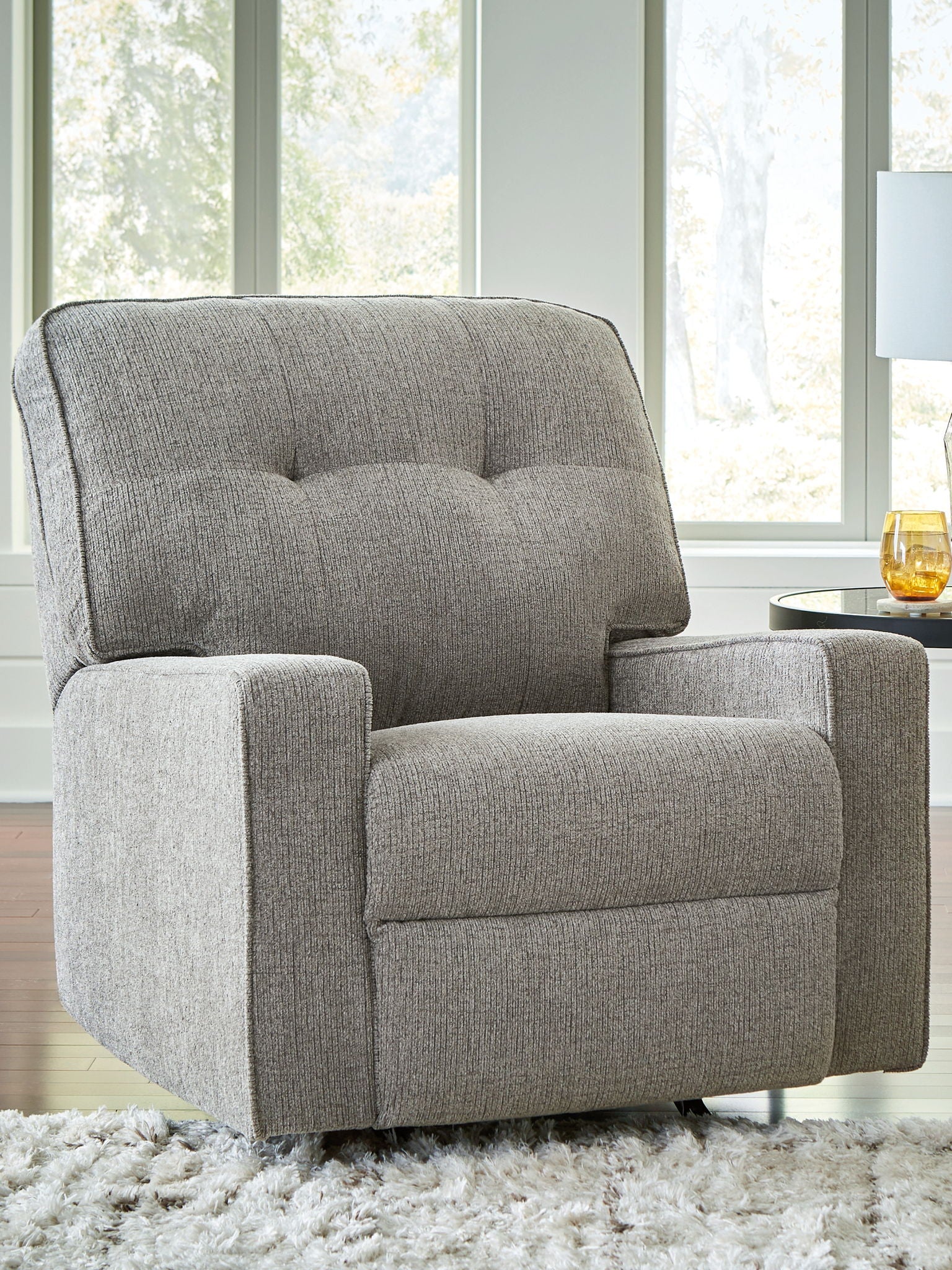 Iron fabric rocker recliner with tufted back and padded arms, front view