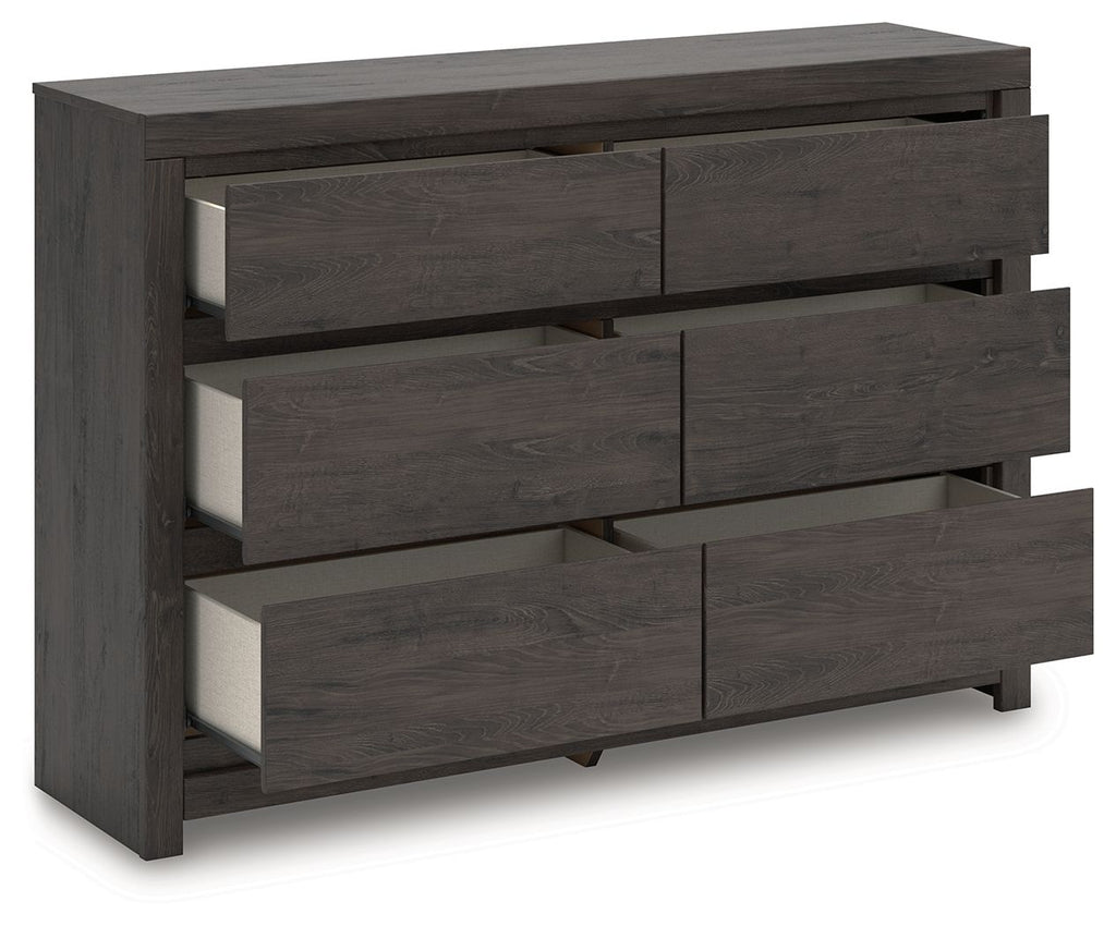 Charcoal six-drawer dresser with drawers pulled open to reveal interiors