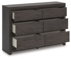 Charcoal six-drawer dresser with drawers pulled open to reveal interiors