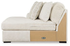 Ivory chaise with beige side panel, metal drawer pull, and stacked throw cushions