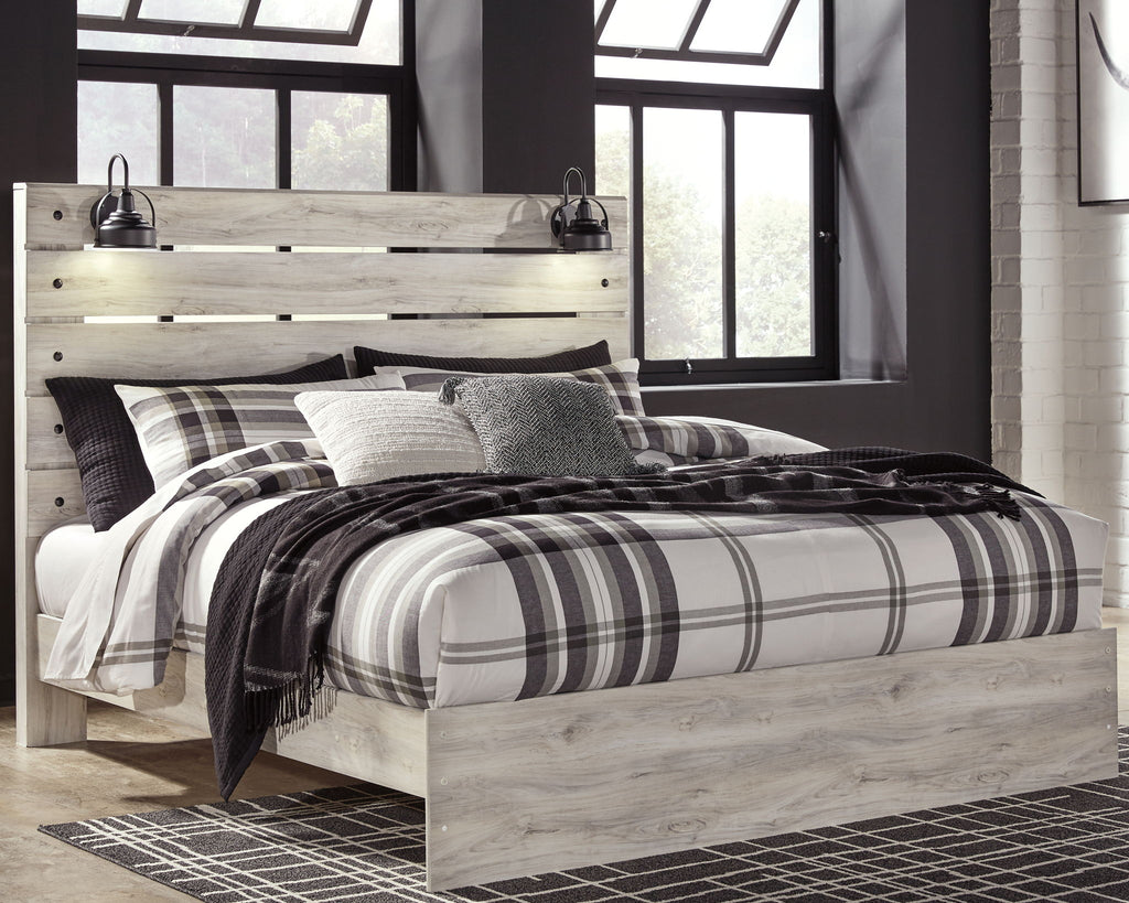 Light wood panel bed with headboard and plaid bedding, with underbed storage drawers