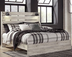 Light wood panel bed with headboard and plaid bedding, with underbed storage drawers