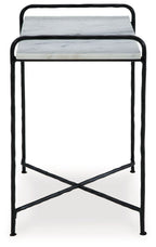 Accent table with white marble-look top and black metal frame, side view