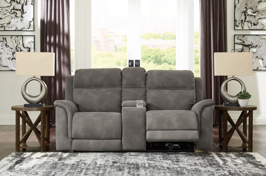 Dark gray reclining power loveseat with center console and cushioned armrests