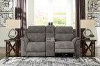 Dark gray reclining power loveseat with center console and cushioned armrests
