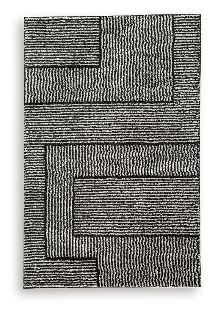 Kurtmen black rug with layered geometric stripe squares, textured surface.
