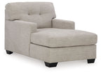 Upholstered chaise chair in pearl silver with tufted back, track arms, and black feet