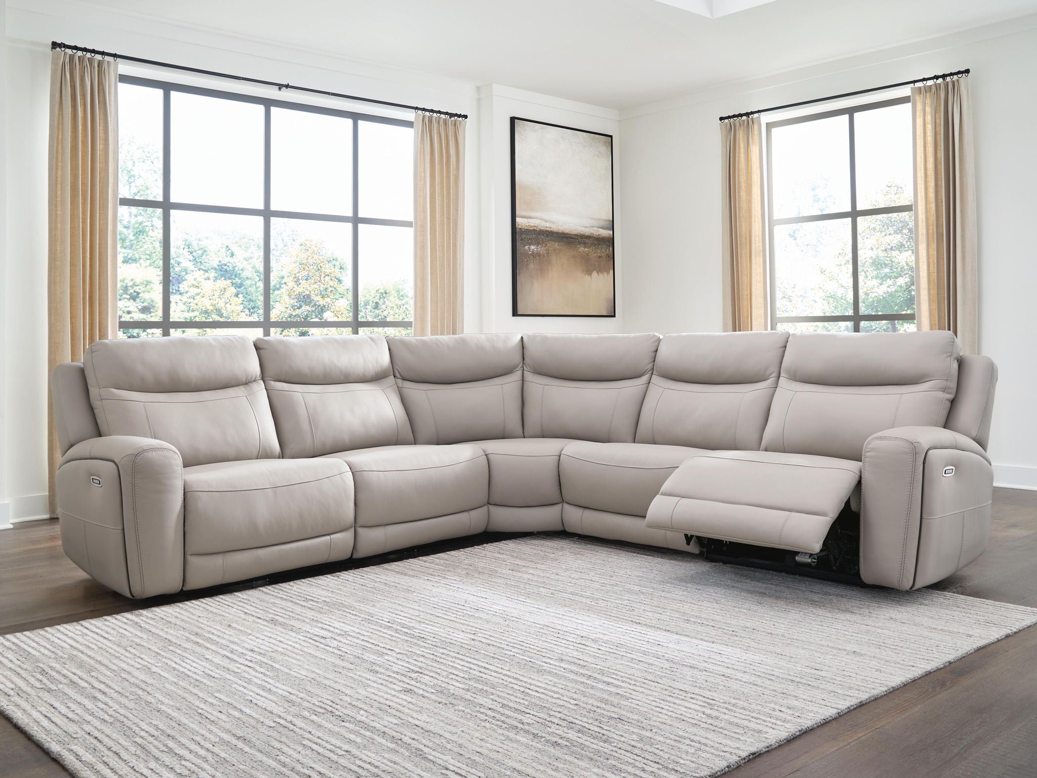 Gray power reclining sectional sofa with corner chaise and open recliner seat cushion