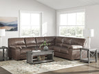 Upholstered sectional sofa with tufted seating and rolled arms, dark brown fabric