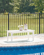 White rectangular cocktail table with four legs and open tabletop