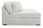 Oversized armless chaise with thick cushions and two textured throw pillows, light gray