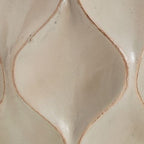 Distressed cream lamp base detail with embossed diamond pattern