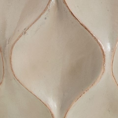 Distressed cream lamp base detail with embossed diamond pattern