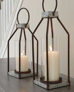 Gray/black metal lanterns with clear glass cylinders and lit candles, square stone bases (2)