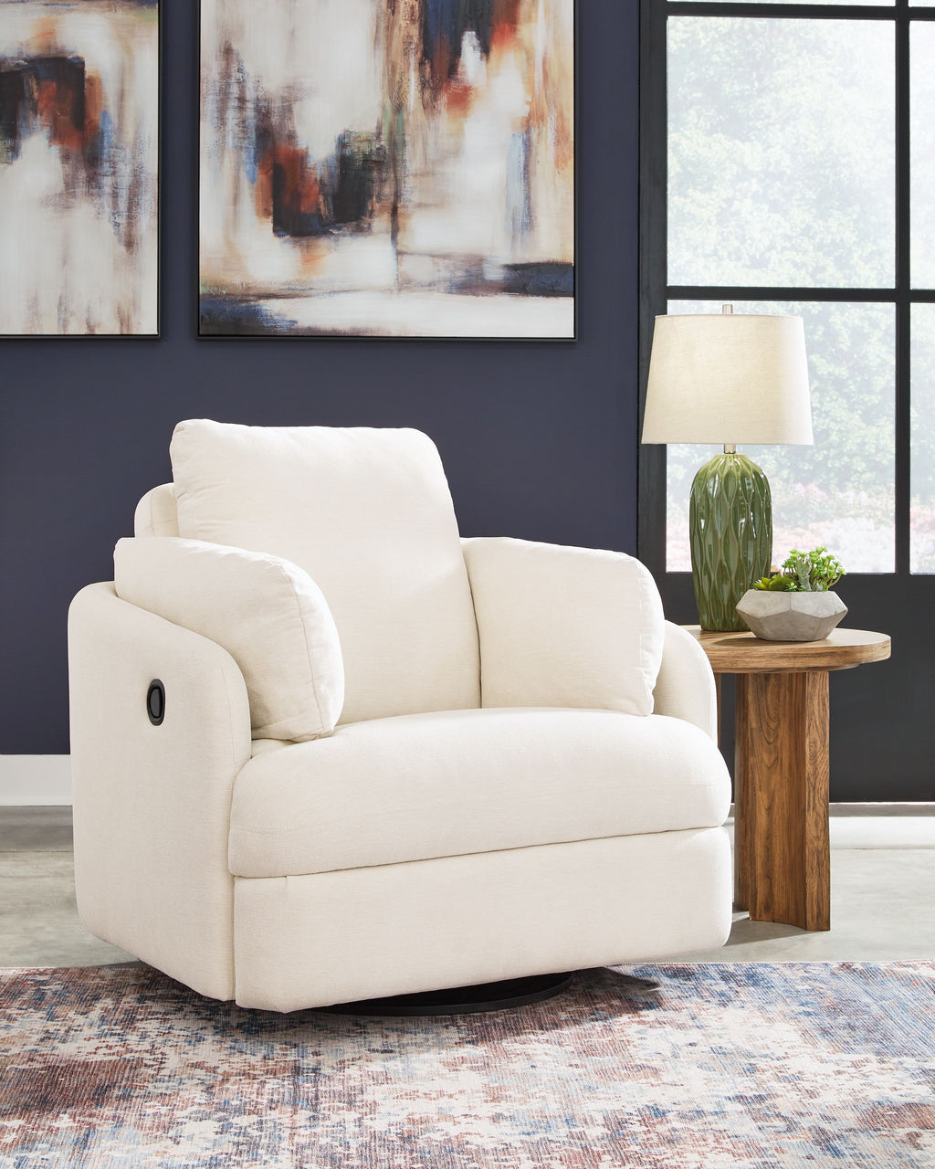 Swivel glider recliner chair in white fabric, rounded arms and wide cushioned seat.