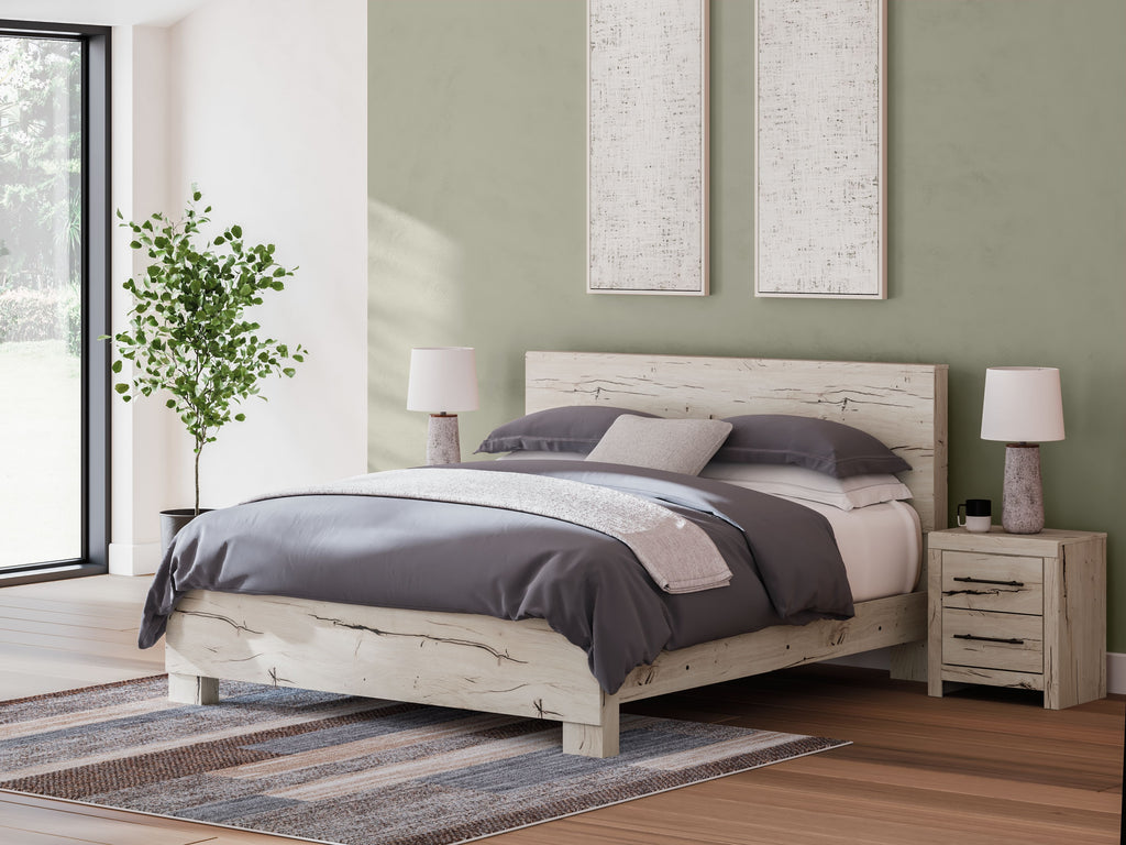Beige panel bed with slatted headboard and footboard, dressed in dark bedding