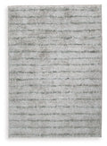 Cream and green area rug with low-pile textured abstract pattern