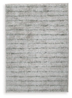 Cream and green area rug with low-pile textured abstract pattern
