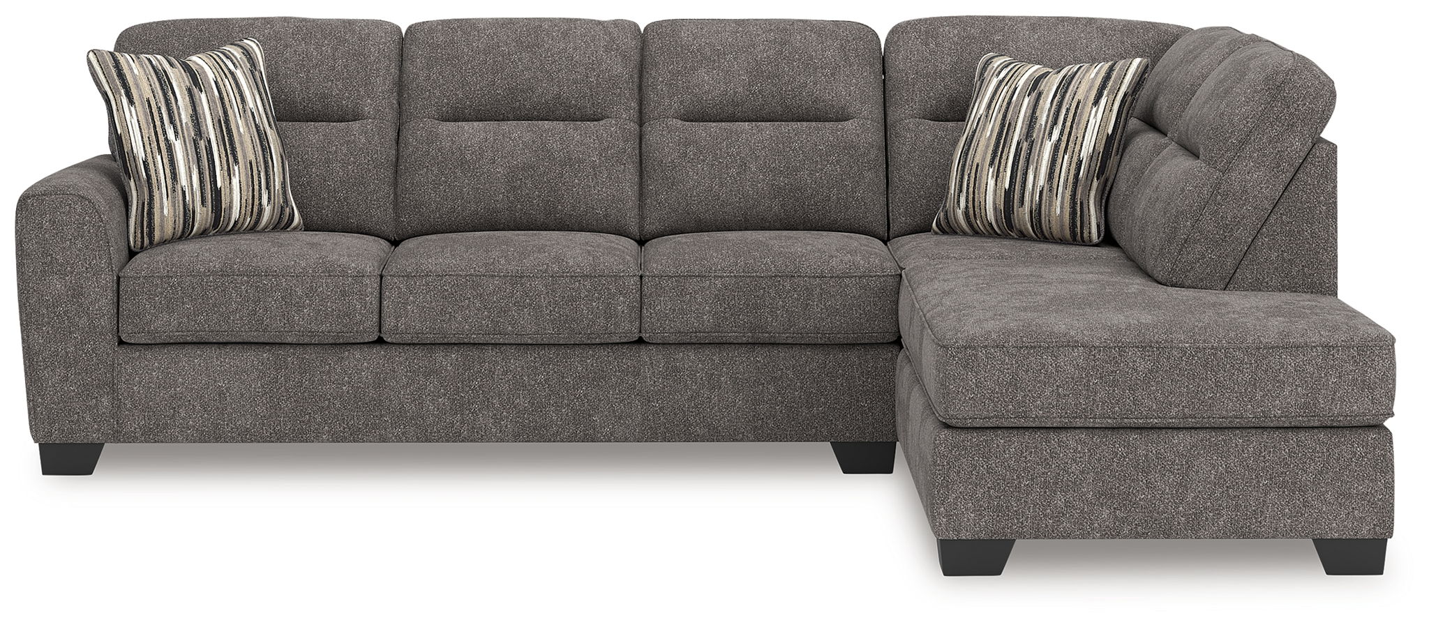 Dark gray sectional sofa with right chaise, tufted cushions, and two striped accent pillows