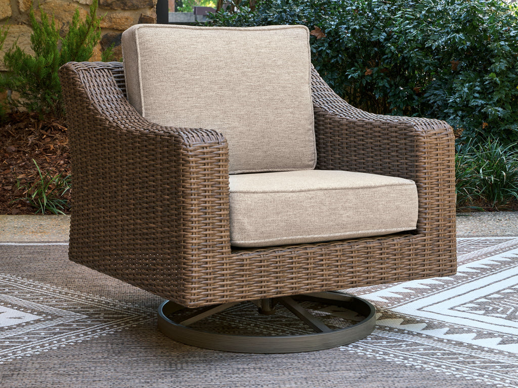 Beige cushion swivel lounge chair with woven brown wicker armrests and round base