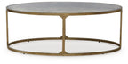 Round coffee table with light gray stone top and gold metal open base