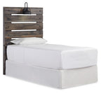 Dark brown panel headboard with horizontal slats and black light fixture, on bed