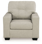 Light beige upholstered accent chair front view with tufted back and wide seat