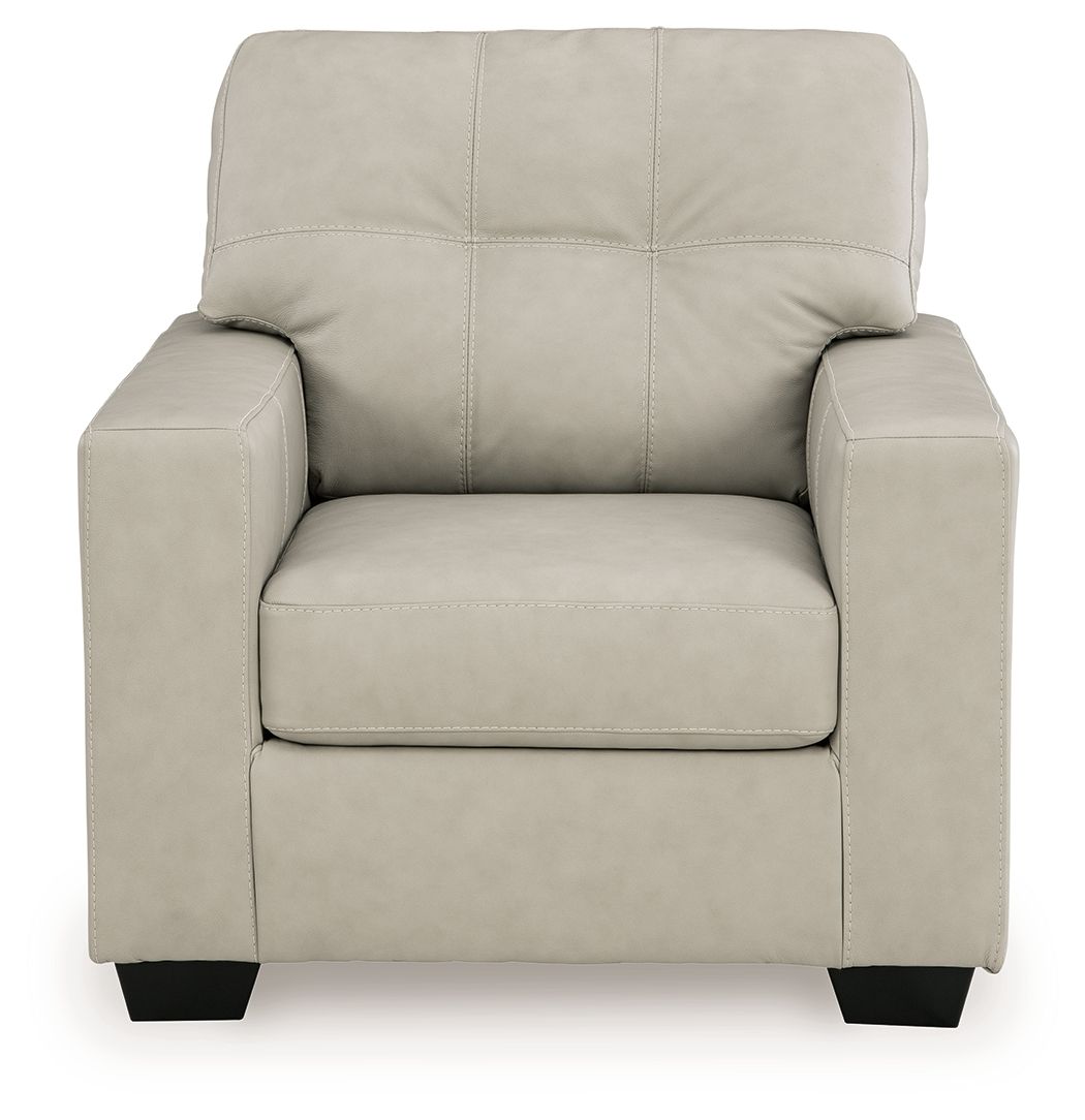 Light beige upholstered accent chair front view with tufted back and wide seat