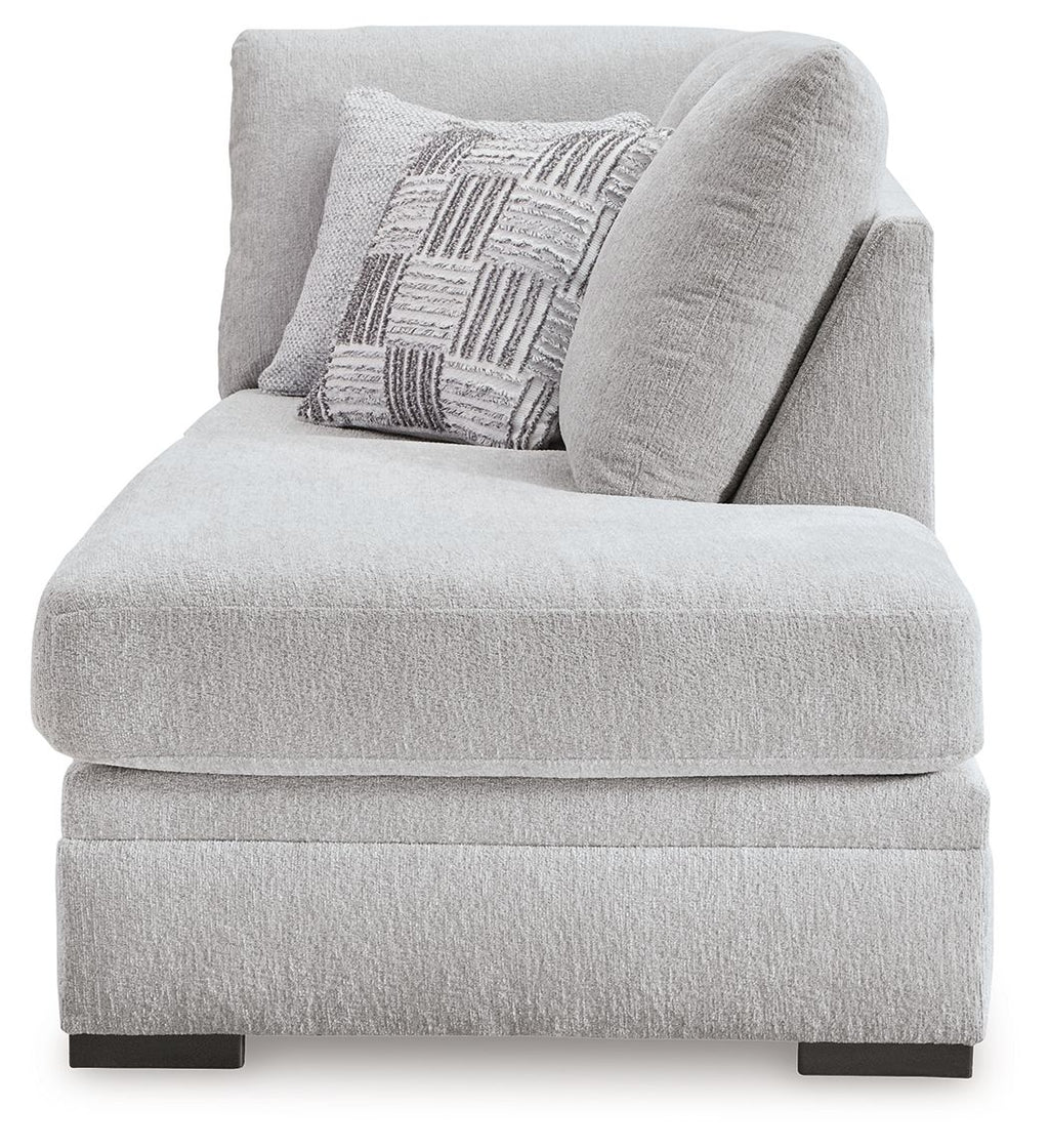 Gabyleigh corner chaise with light gray upholstered arm, throw pillow, and low legs