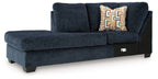 Aviemore dark ink corner chaise with tufted back, armrest, and geometric throw pillows