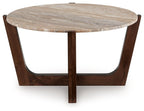 Round cocktail table with warm brown legs and round light wood tabletop