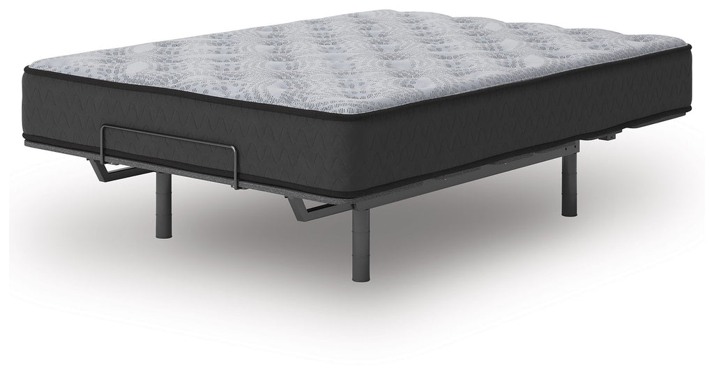 Gray mattress with quilted top and dark base on black metal legs