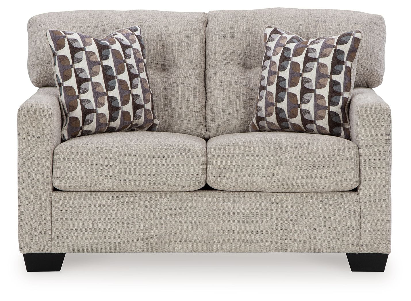 Light beige loveseat with two patterned throw pillows and split seat cushions
