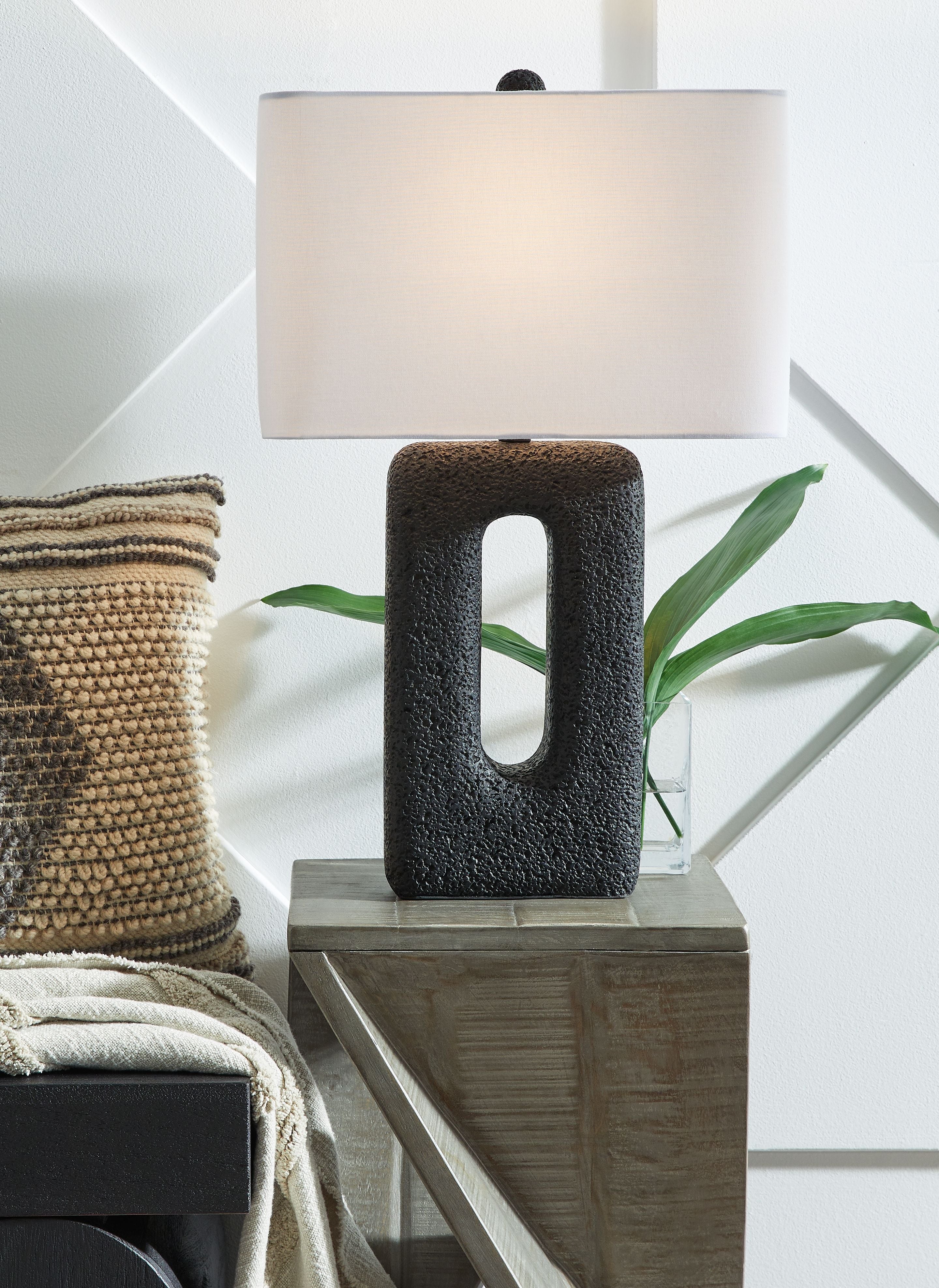 Table lamp with black textured base and white rectangular fabric shade