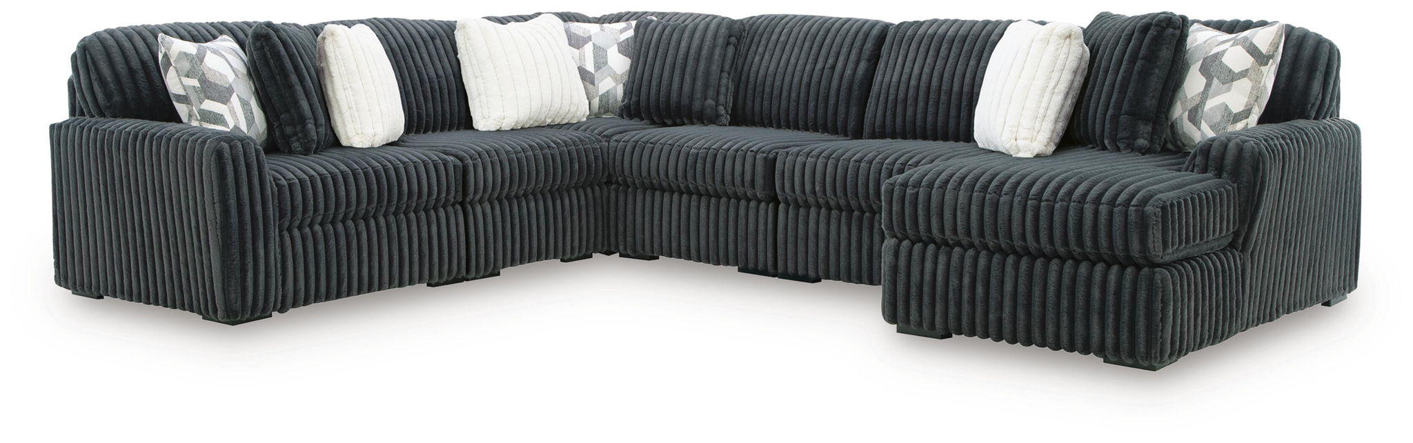 Dark charcoal sectional sofa with corner chaise, ribbed upholstery and striped pillows