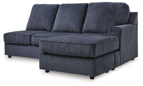 Sofa chaise sectional in dark cobalt fabric with three back cushions and chaise ottoman