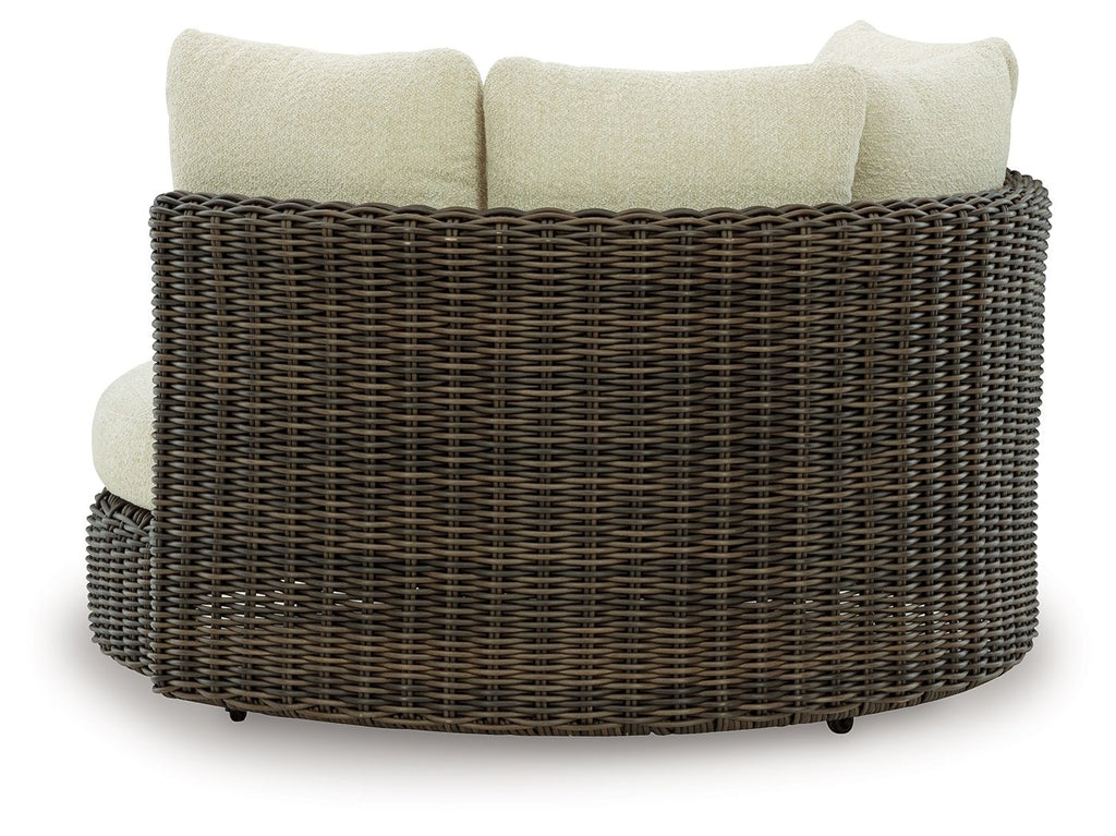 Swivel lounge chair with cushion, dark brown woven wicker with beige back and seat pillows