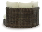 Swivel lounge chair with cushion, dark brown woven wicker with beige back and seat pillows
