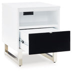 White chair side end table with open black drawer and top power outlet strip