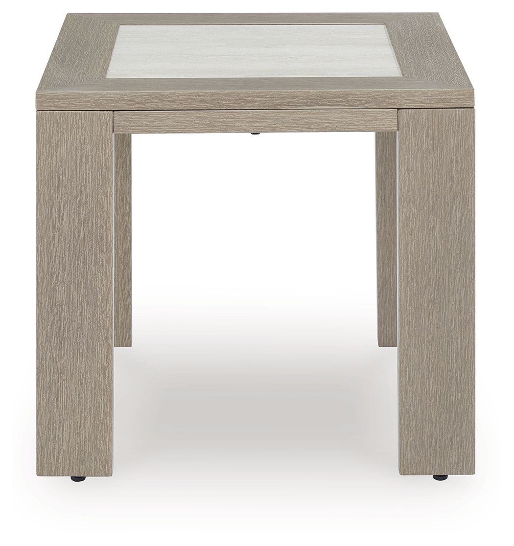 Beige square table with inset top, open underside, and corner feet
