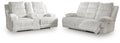 Power reclining sofa and loveseat set in light gray striped fabric with padded arms