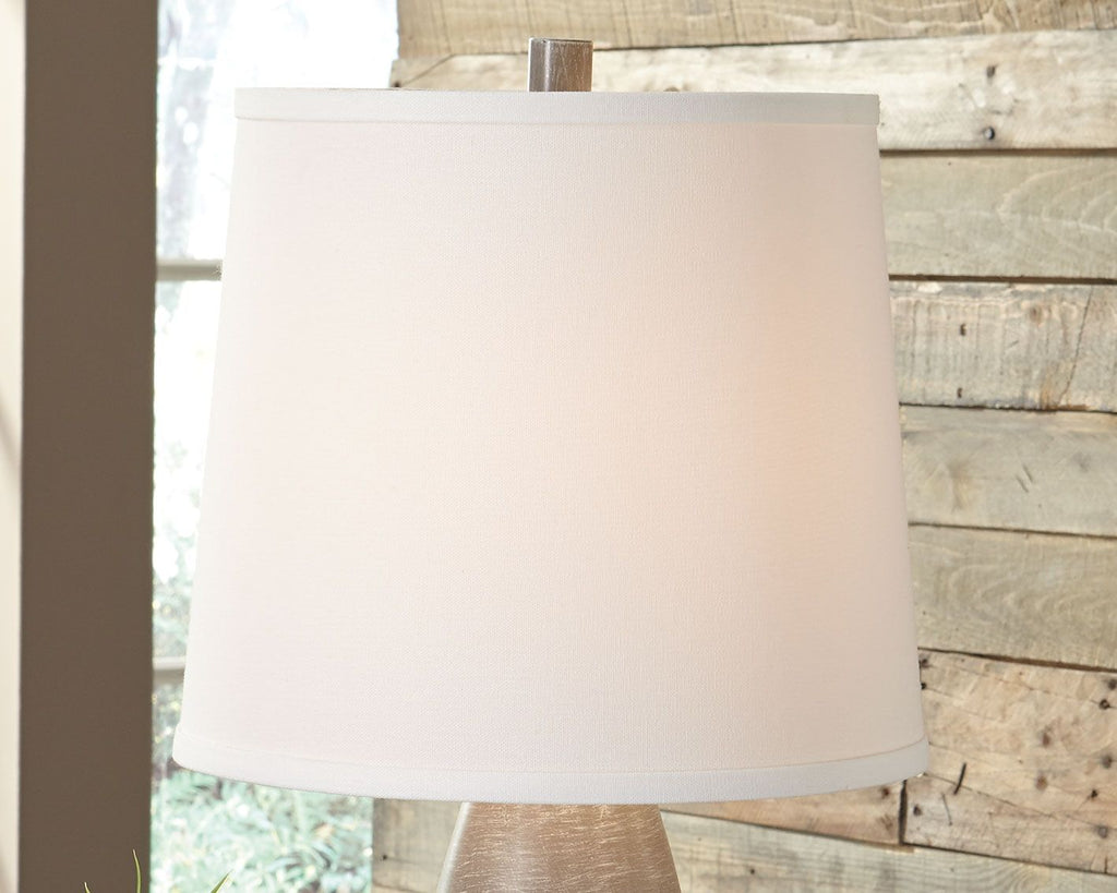 Table lamp with white fabric shade and dark gray textured base